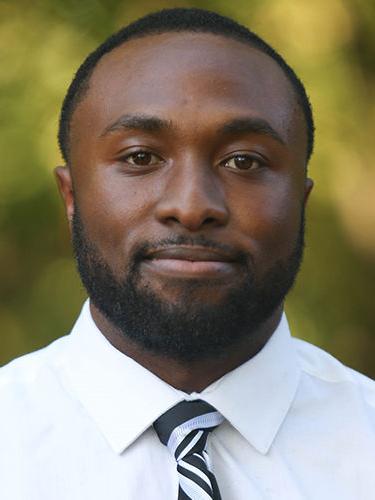 Headshot of Justin Dunbar-Stevens